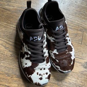 APL cow pattern sneakers. Super comfortable for the gym, or for wear outside.